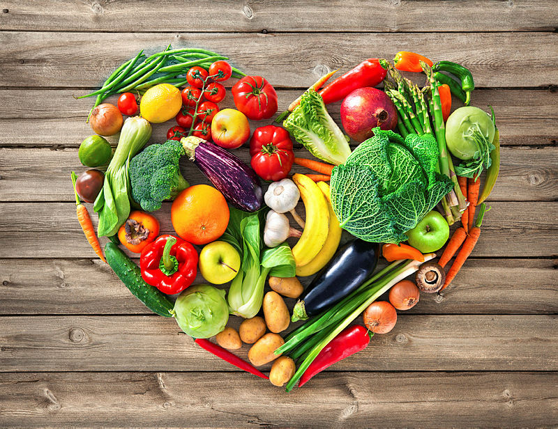 Vegetables arranged in a heart shape — nutrition and health coaching